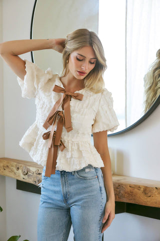 BUBBLE BABYDOLL BLOUSE WITH TEXTURED FABRIC AND CONTRAST BOW