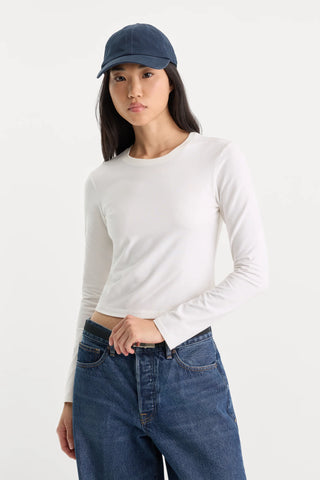 Good American | The Long Sleeve Baby Tee in White