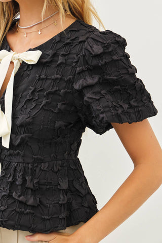 BUBBLE BABYDOLL BLOUSE WITH TEXTURED FABRIC AND CONTRAST BOW