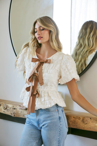 BUBBLE BABYDOLL BLOUSE WITH TEXTURED FABRIC AND CONTRAST BOW