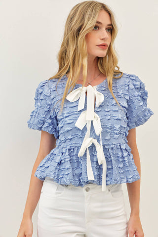 BUBBLE BABYDOLL BLOUSE WITH TEXTURED FABRIC AND CONTRAST BOW