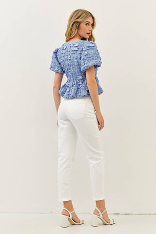 BUBBLE BABYDOLL BLOUSE WITH TEXTURED FABRIC AND CONTRAST BOW